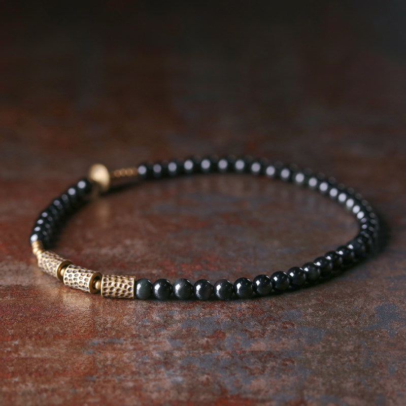 Flatlay shot of the Celestial Weaver bracelet, highlighting its sculptural geometric aesthetic.