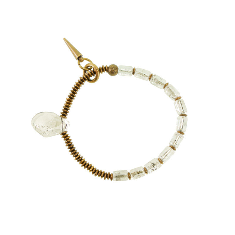 Professional studio product shot of the brass and crystal bracelet isolated on a clean white background.